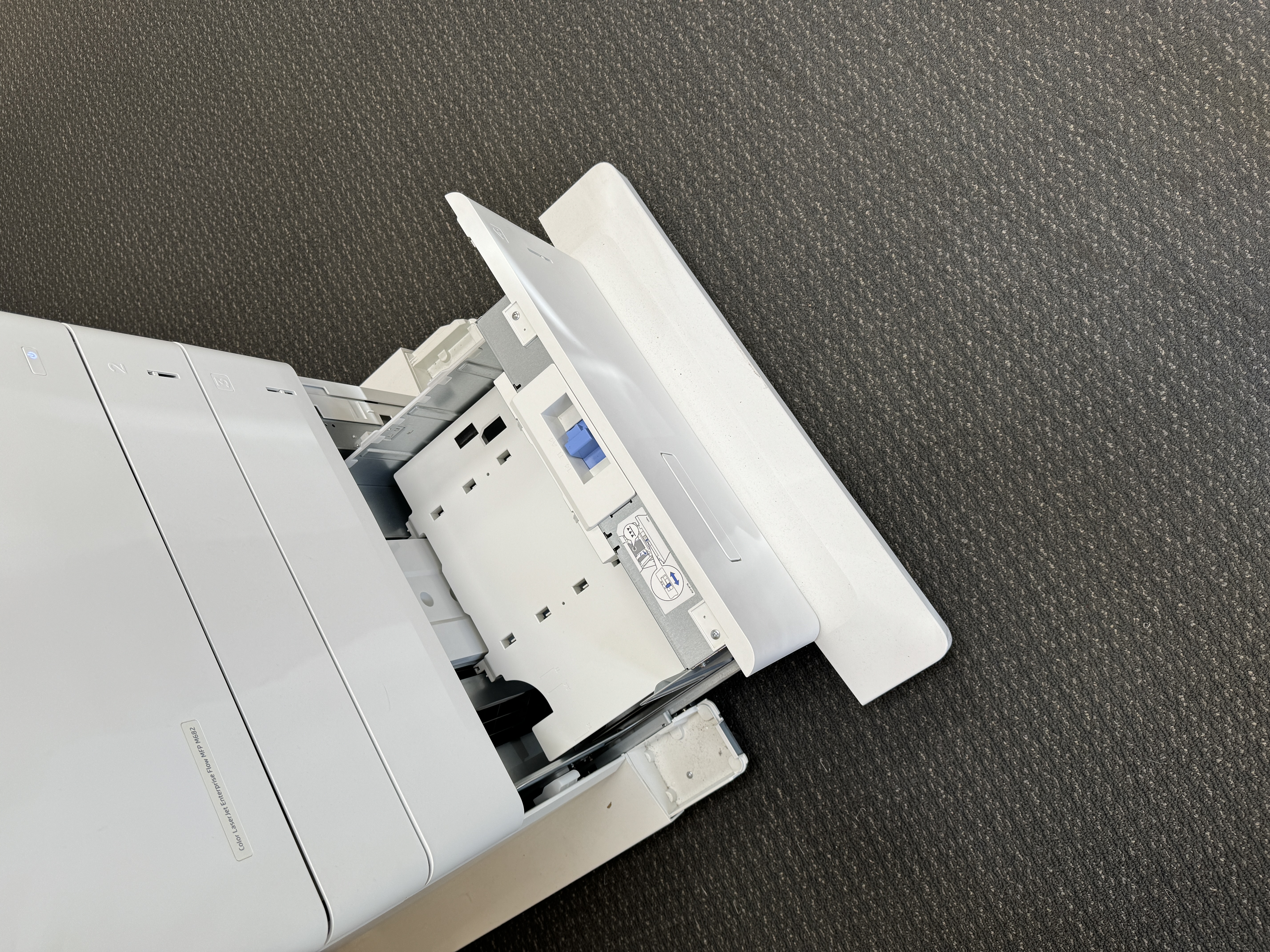 Paper drawer on a HP m682 printer copy mahcine.