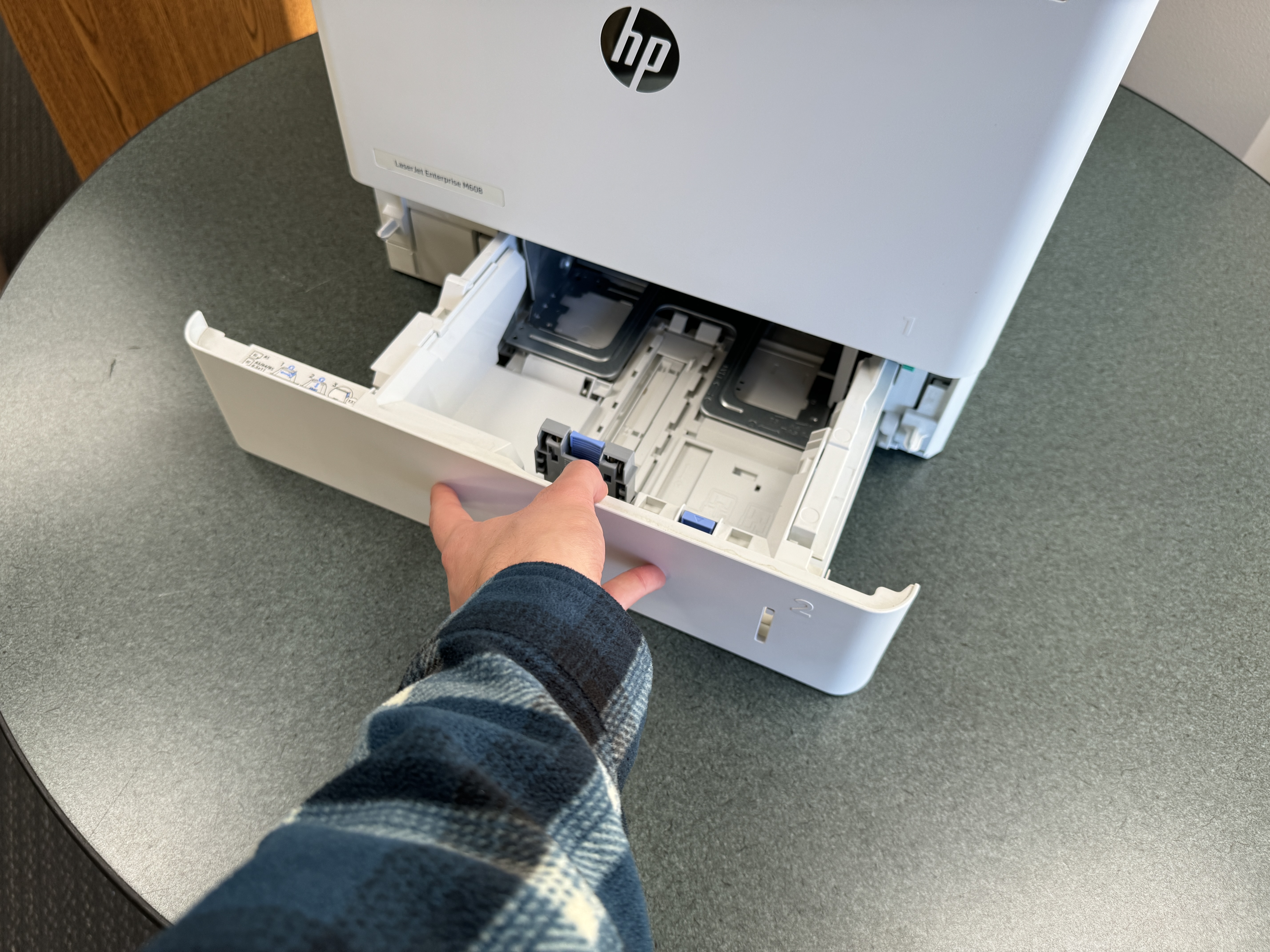 HP laser printer repair of a m608 500 sheet paper tray. 