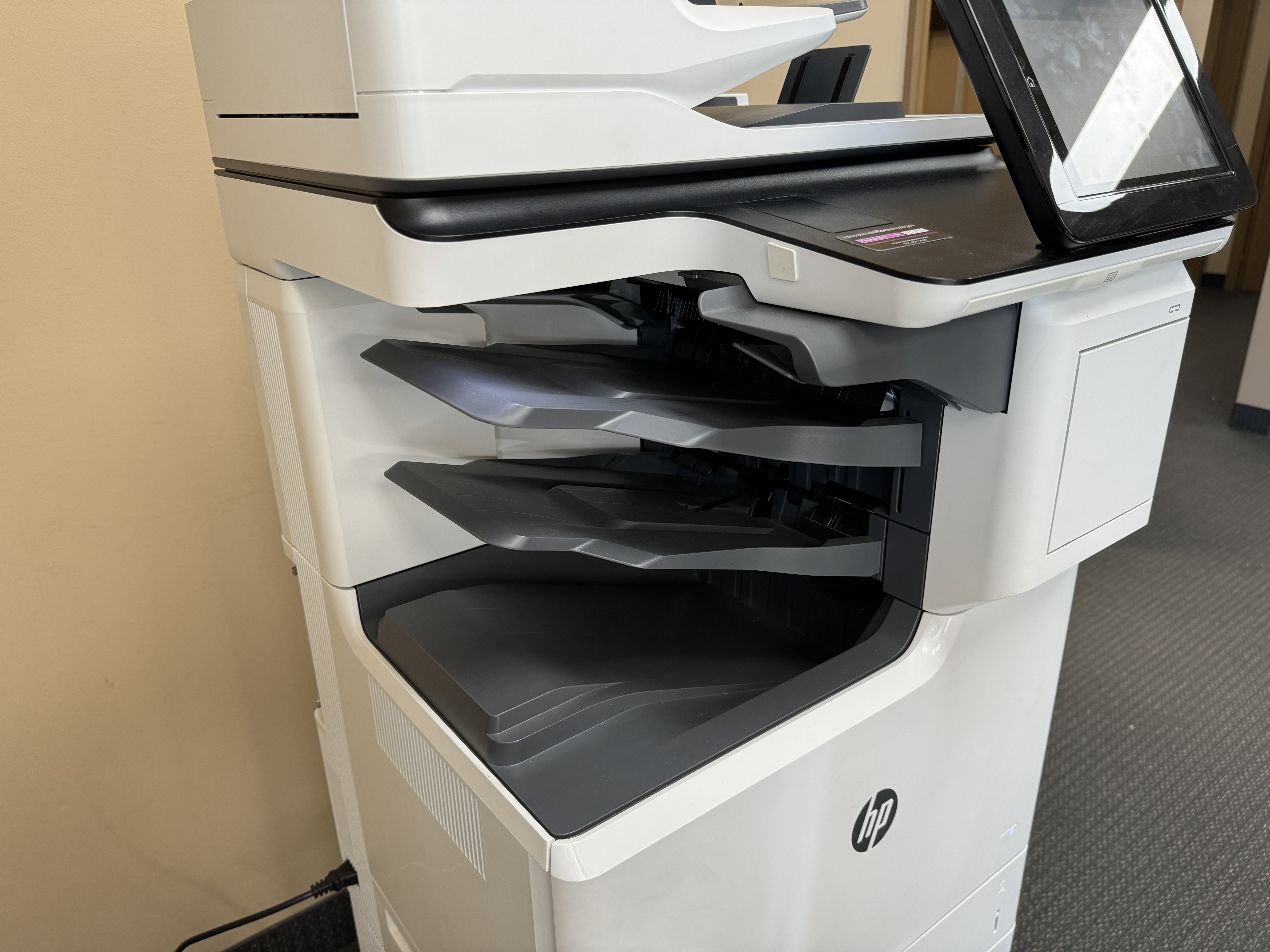 HP m682 color copier used in a used IOT copier lease. 