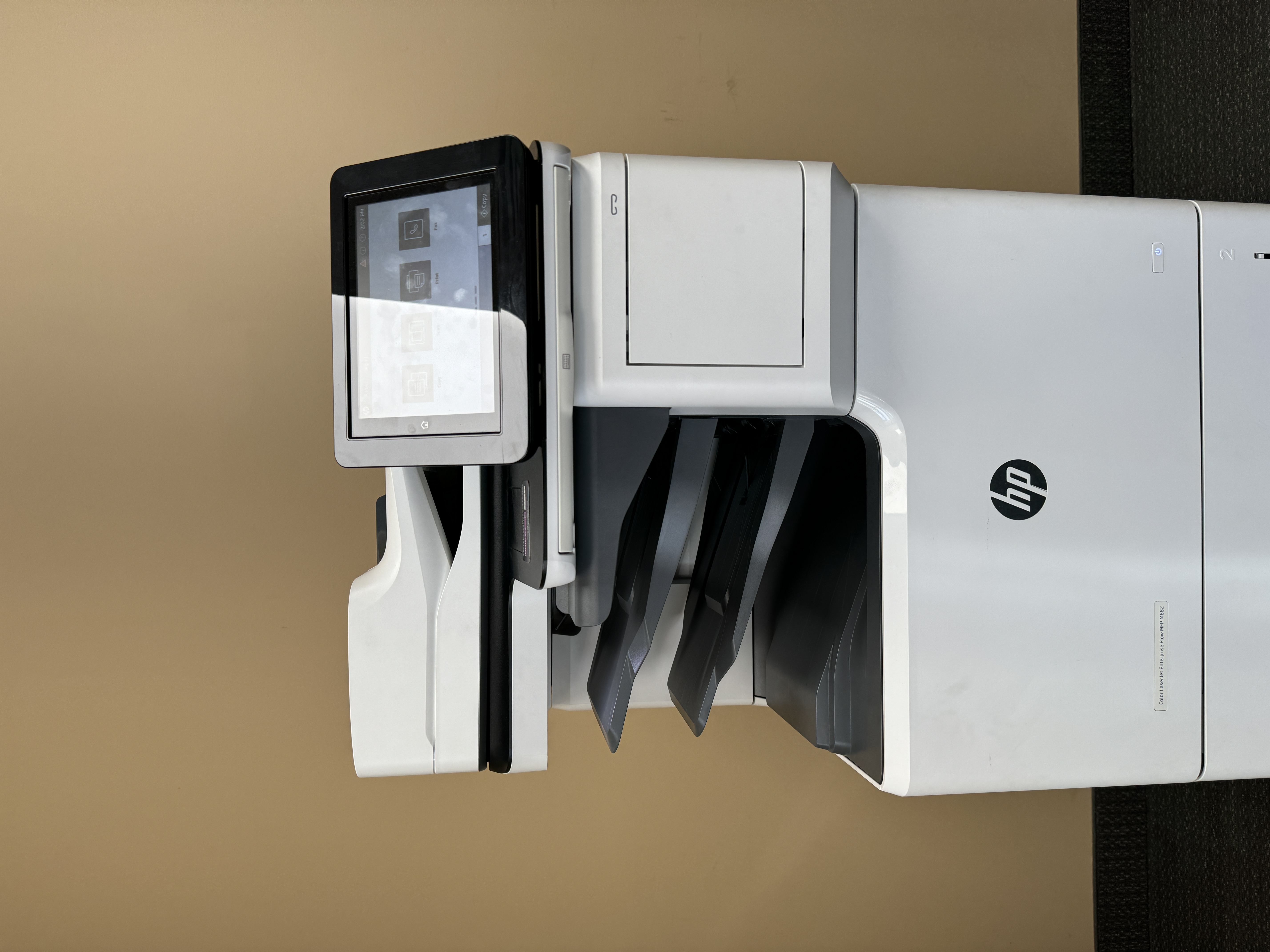 Copier repair service of a HP m682 MFP.