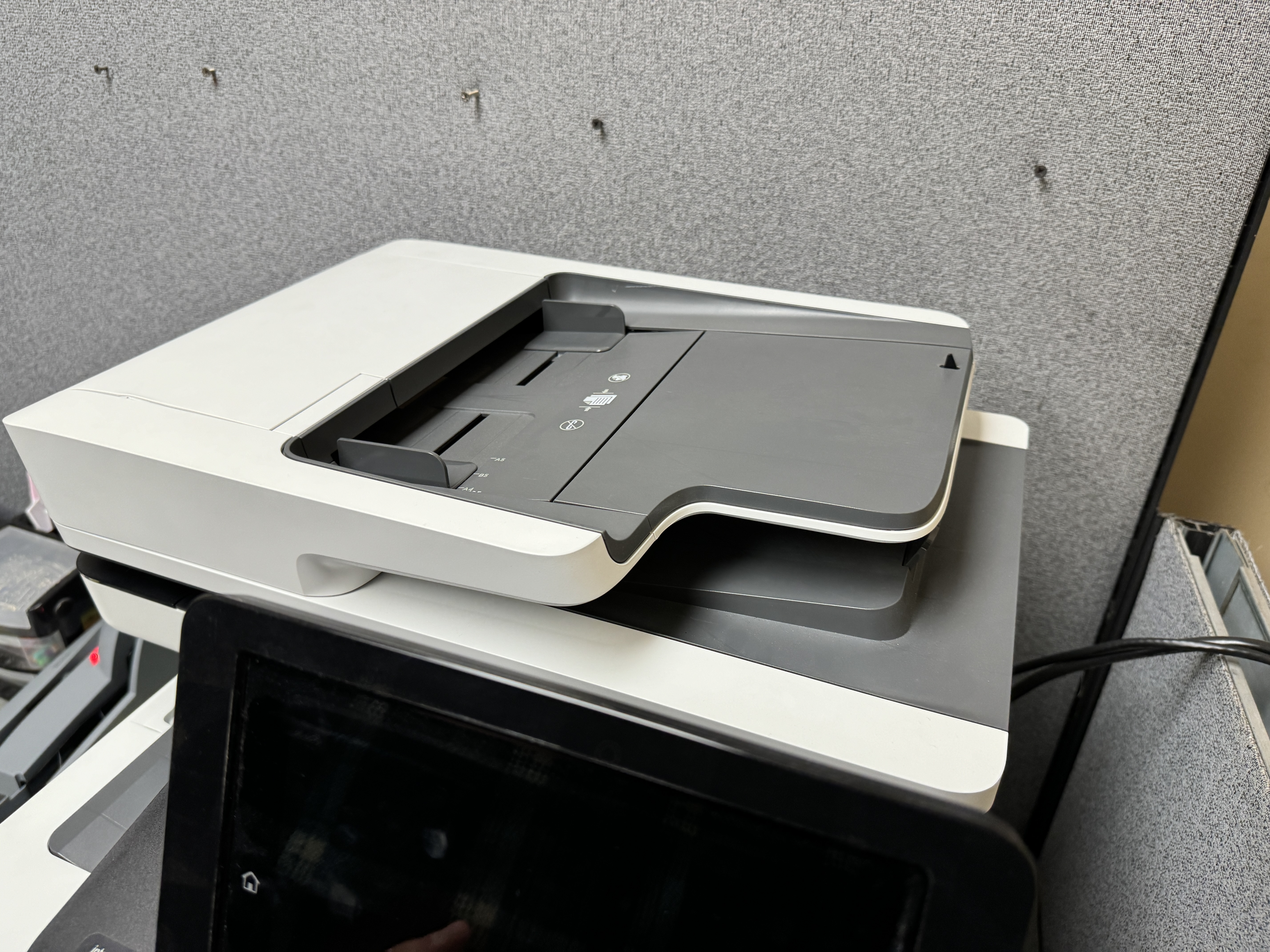 Closed ADF for a HP m577 color MFP.