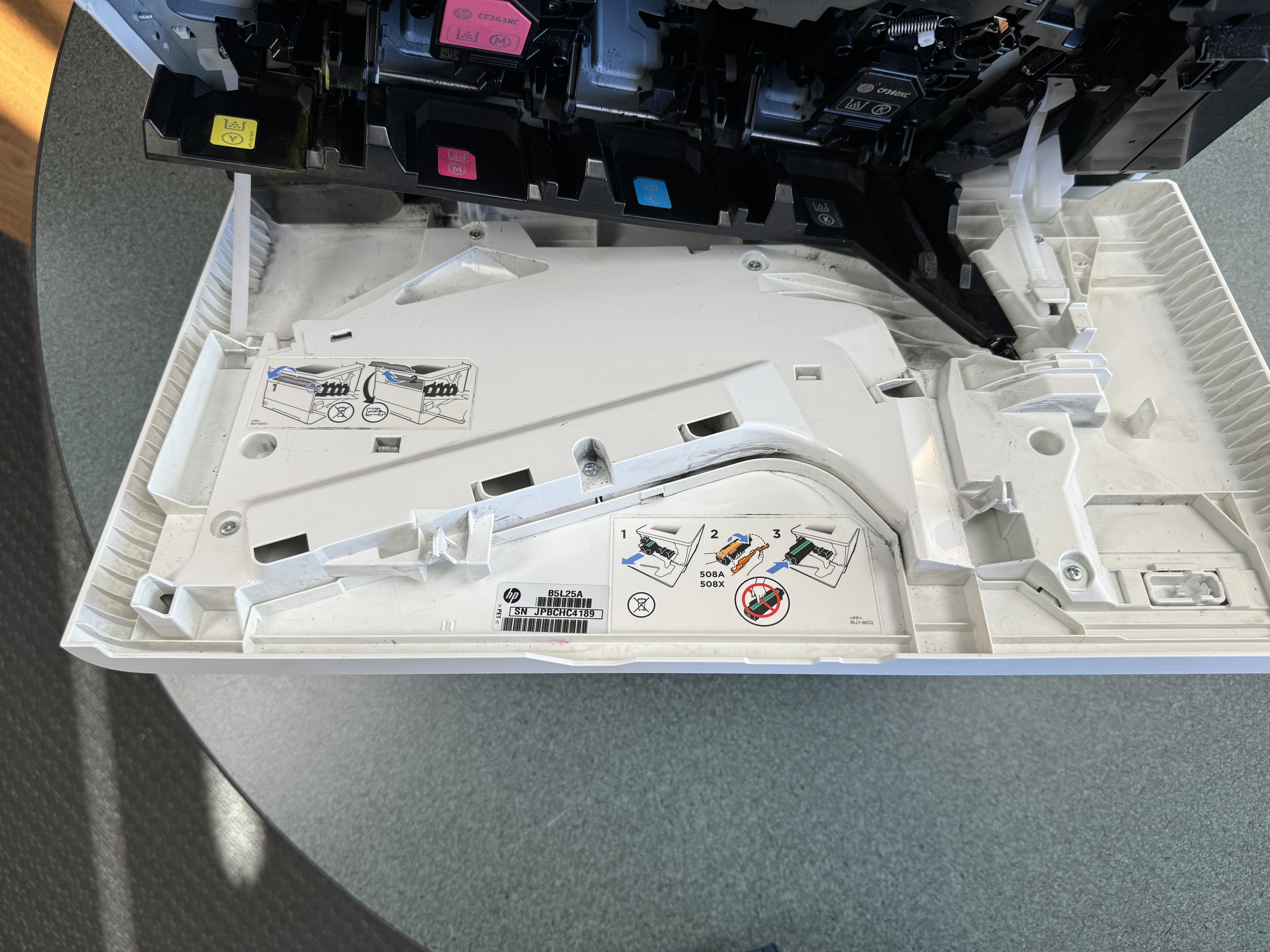 HP M553 color laser printer toner door.