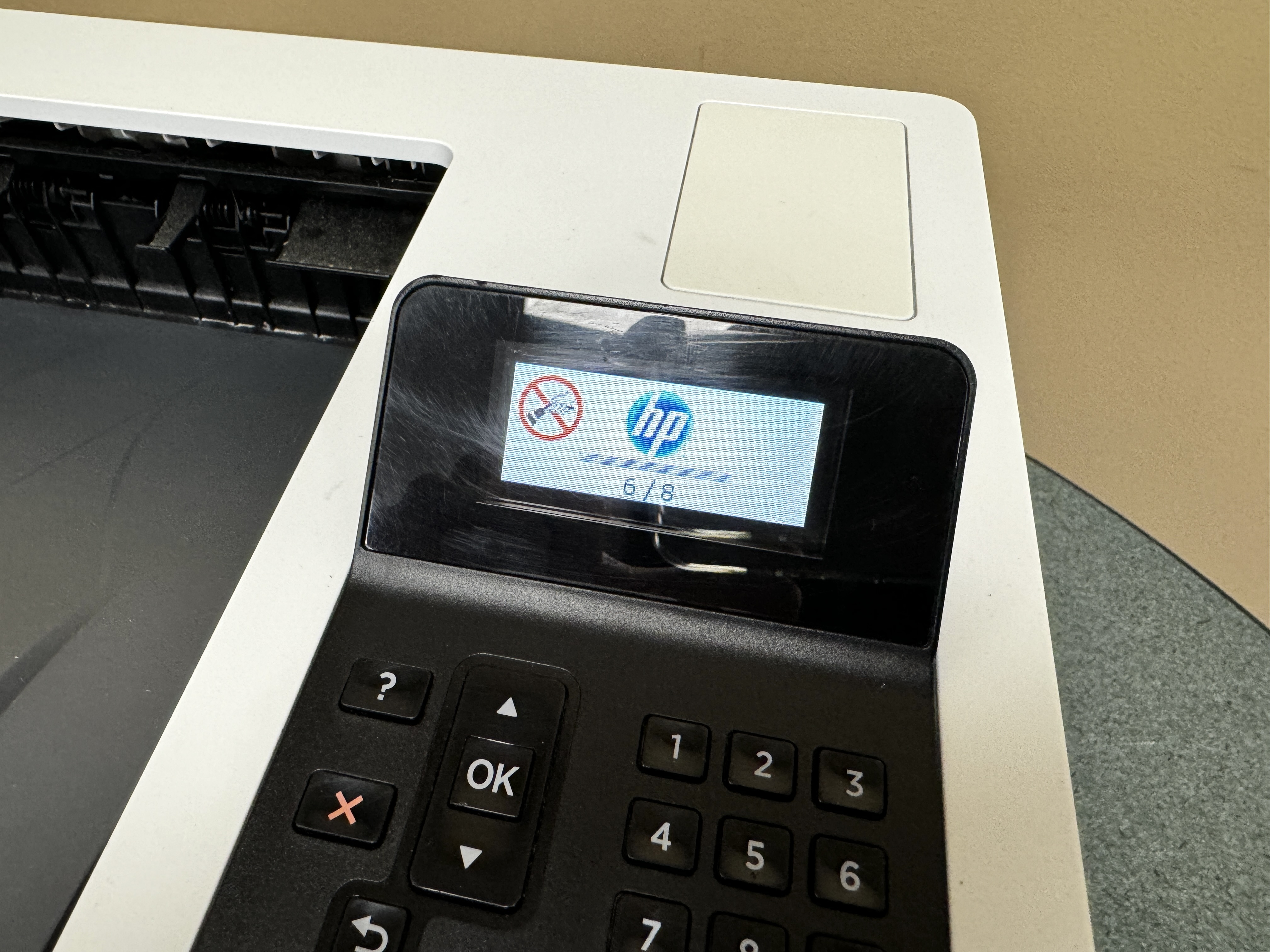 Display panel on a HP 402 printer.